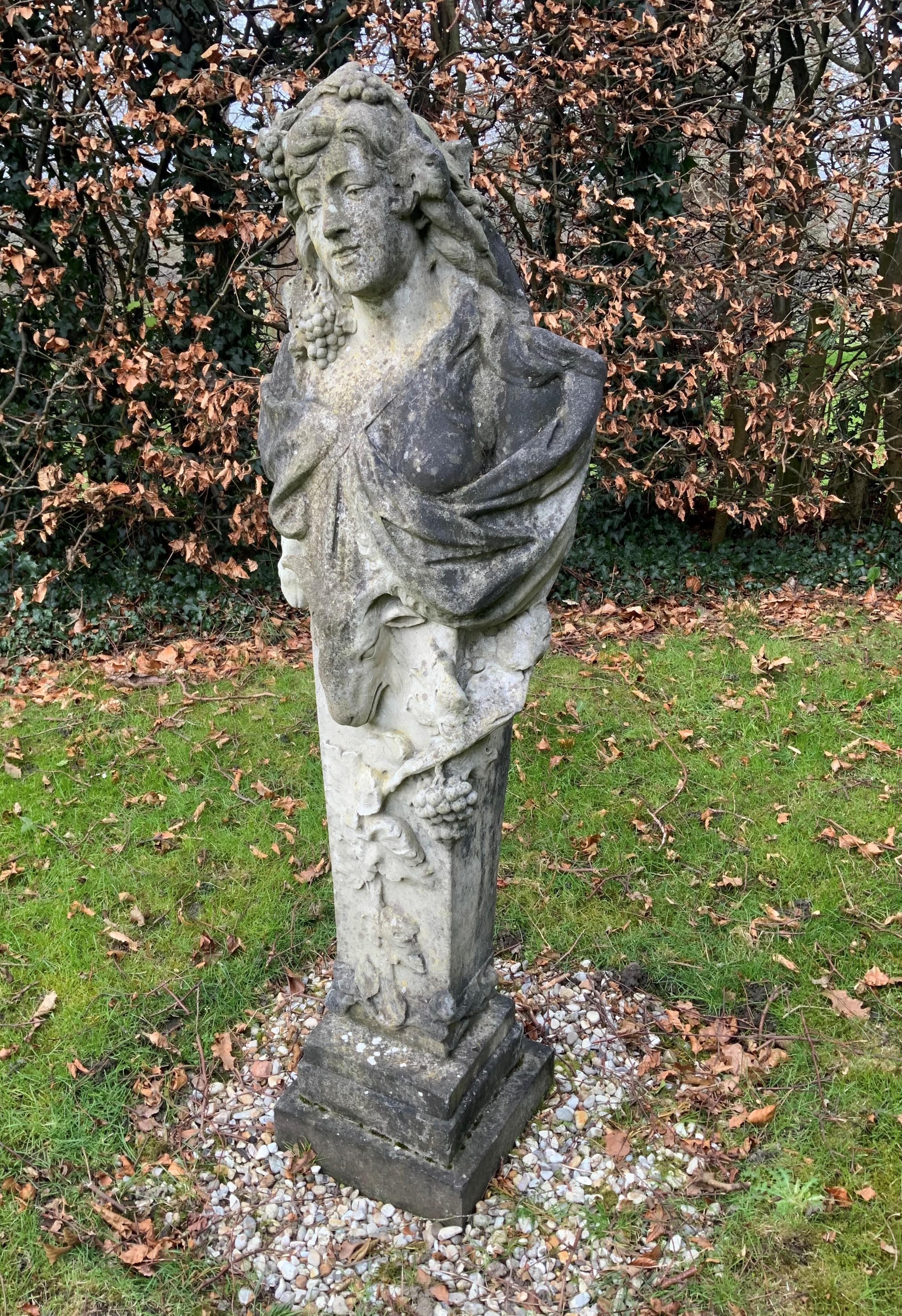 A reconstituted stone figure of a term, on a stepped square plinth, height 156cm